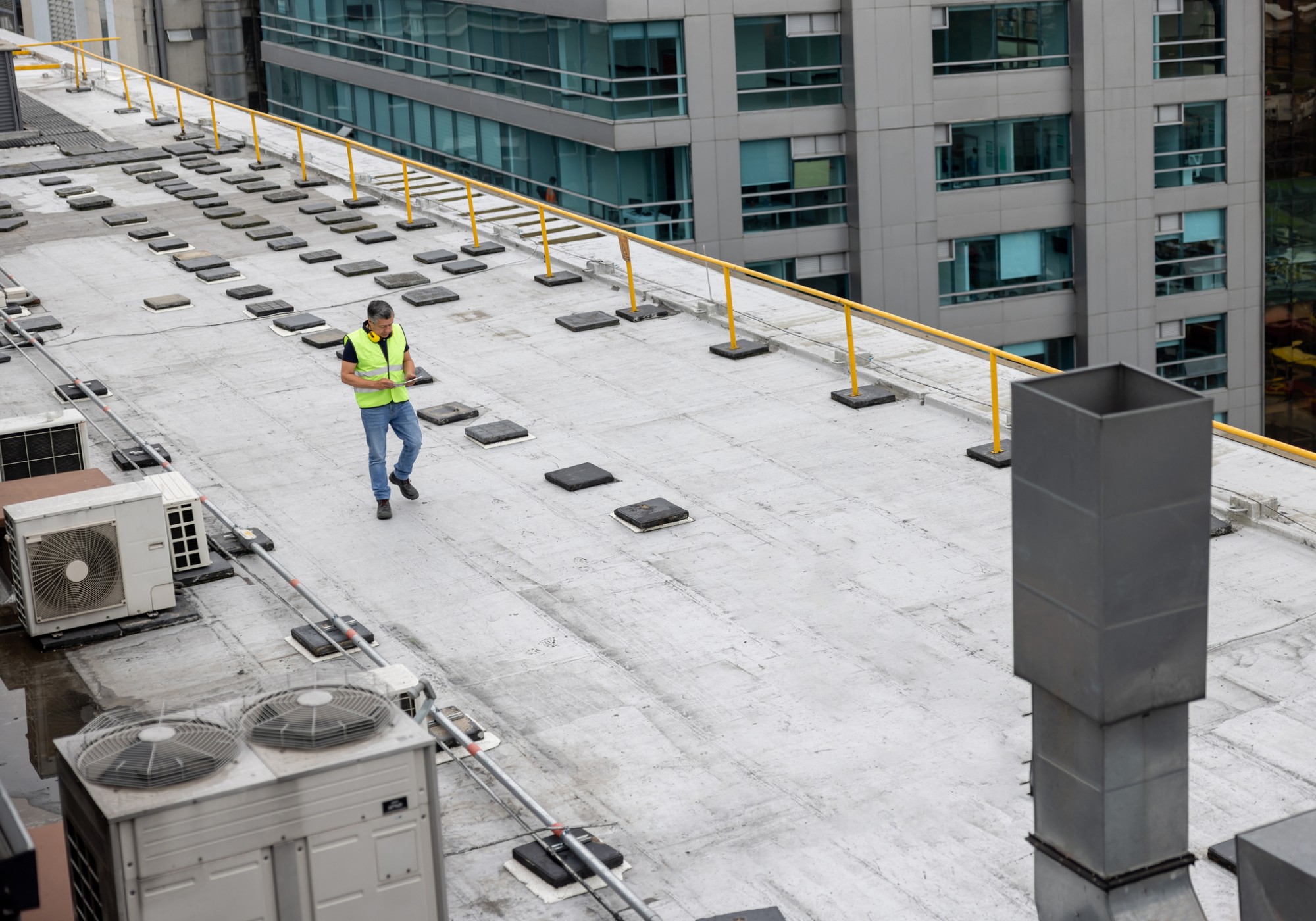 Man inspecting rooftop construction site