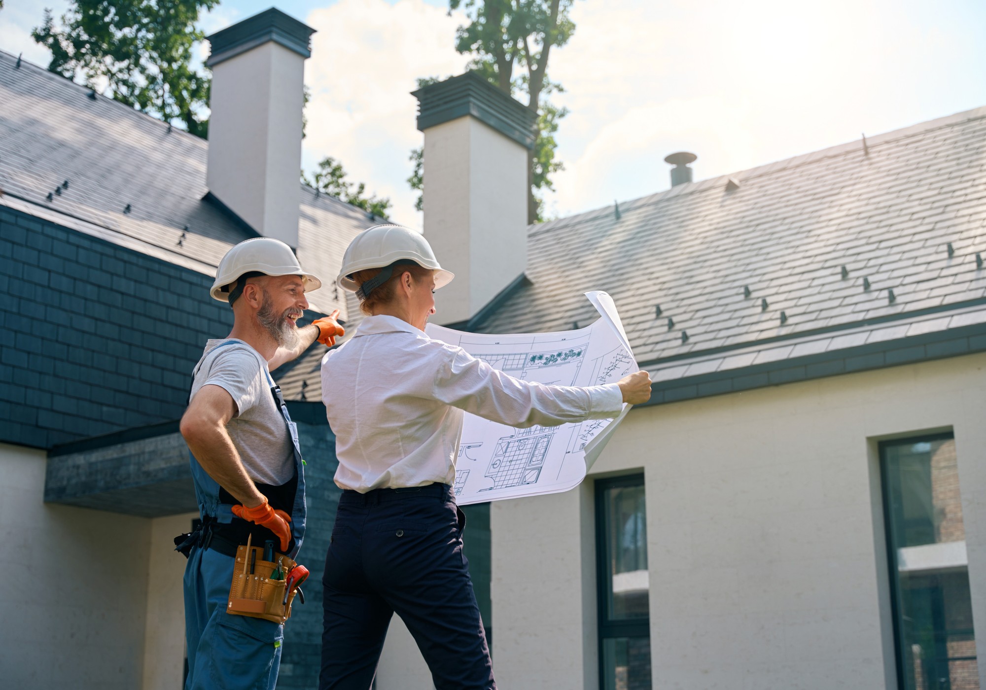 Construction workers reviewing building plans