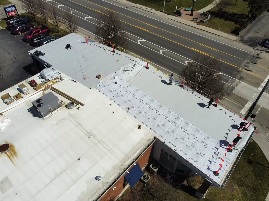 Building roof under construction near a road.