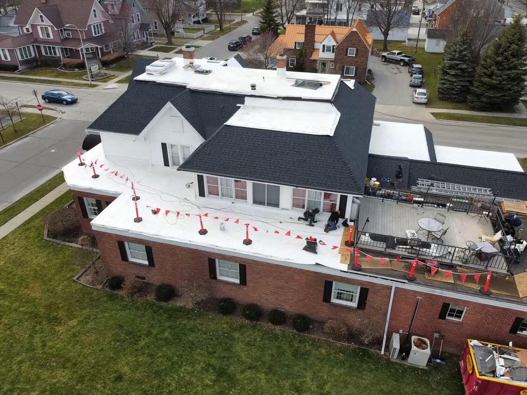 Rooftop patio on a large brick building.